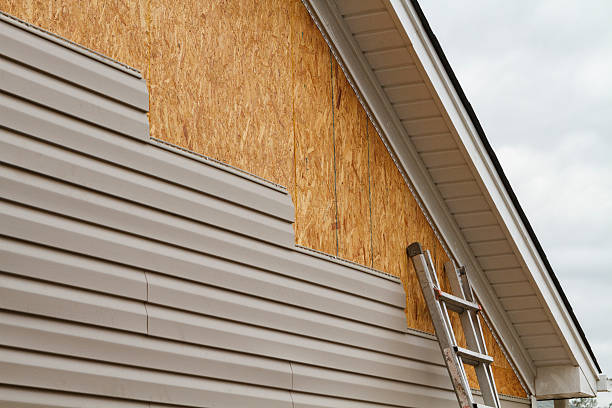 Professional Storm Damage Siding Repair technician working in Bellbrook, OH
